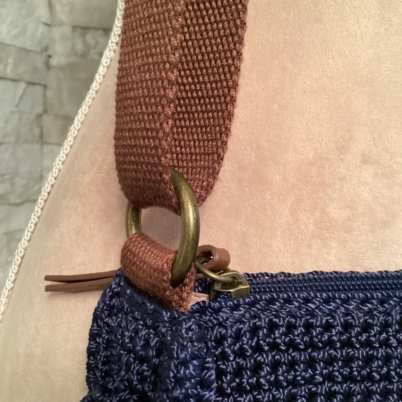 The Sak Ryder crochet crescent crossbody bag in navy blue with a tassel - Picture 9 of 14